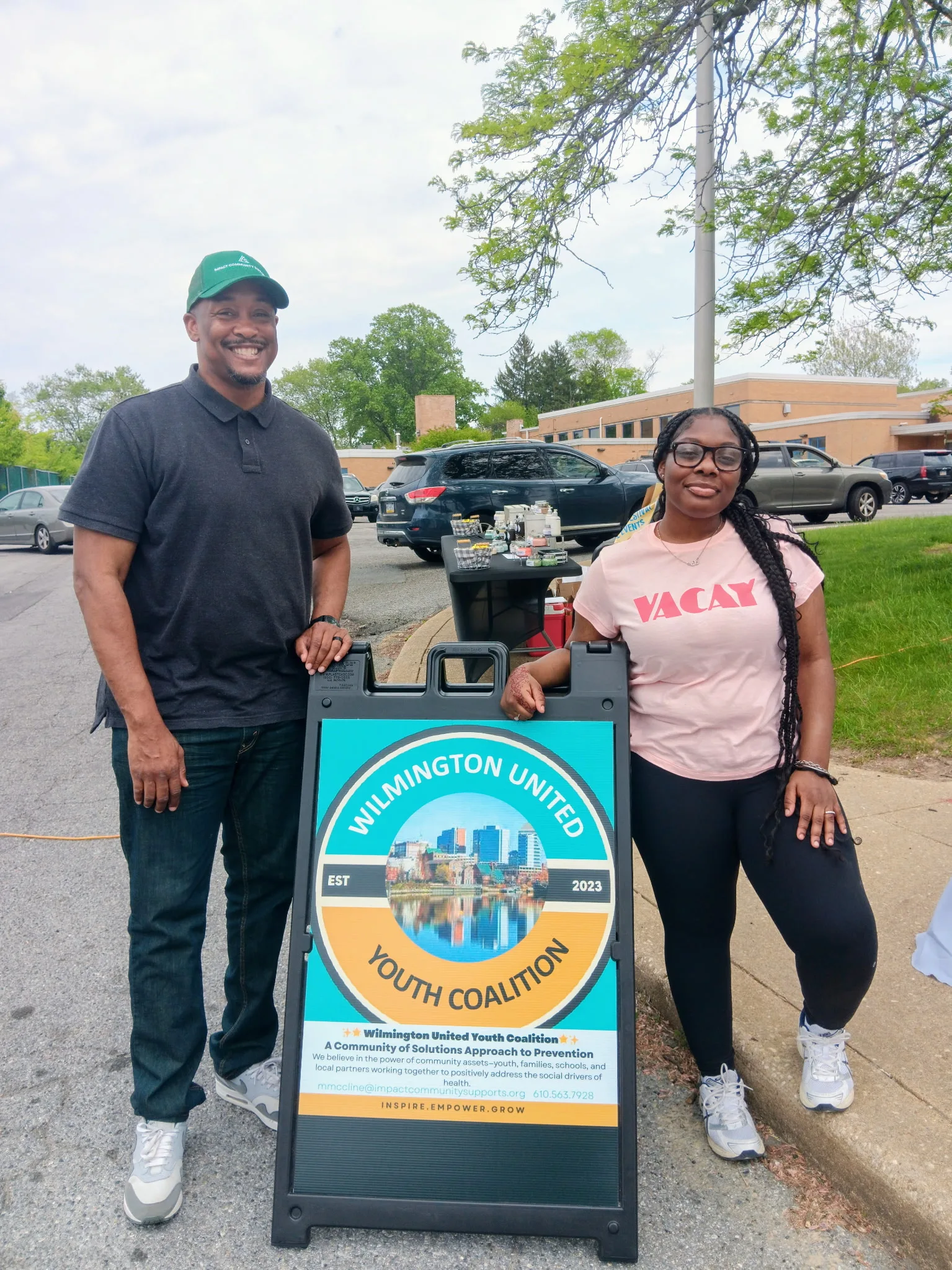 Michael McCline with a Wilmington United Coalition partner at a community event